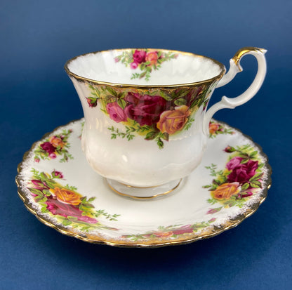 Black Cup and Saucer with Roses on White Background Inside the Cup. Royal Albert Old Country Rose Tea Set. Hand Painted Pink & Red Roses.