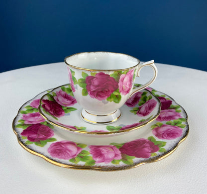 Black Cup and Saucer with Roses on White Background Inside the Cup. Royal Albert Old Country Rose Tea Set. Hand Painted Pink & Red Roses.