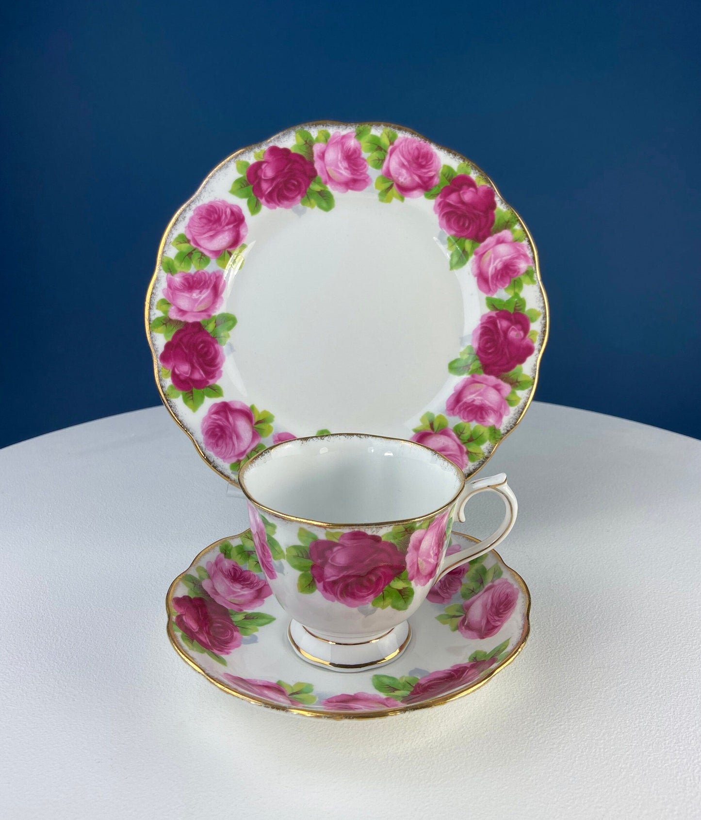 Black Cup and Saucer with Roses on White Background Inside the Cup. Royal Albert Old Country Rose Tea Set. Hand Painted Pink & Red Roses.