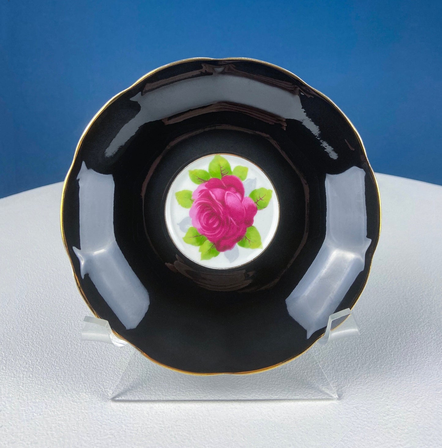 Black Cup and Saucer with Roses on White Background Inside the Cup. Royal Albert Old Country Rose Tea Set. Hand Painted Pink & Red Roses.