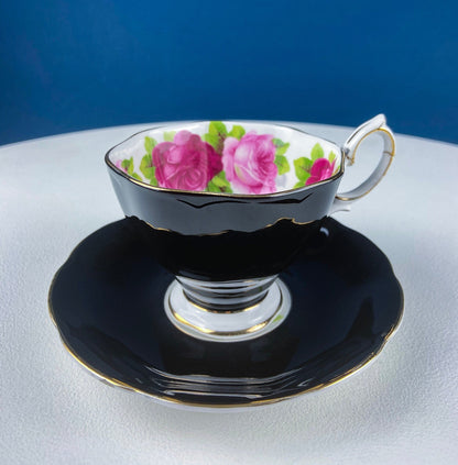 Black Cup and Saucer with Roses on White Background Inside the Cup. Royal Albert Old Country Rose Tea Set. Hand Painted Pink & Red Roses.